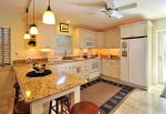 Fully equipped kitchen w/dishwasher, microwave, glass top stove, breakfast bar